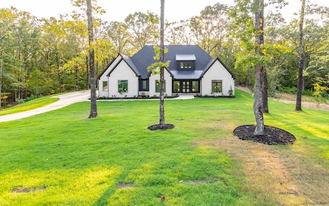 view of front of home with a front yard