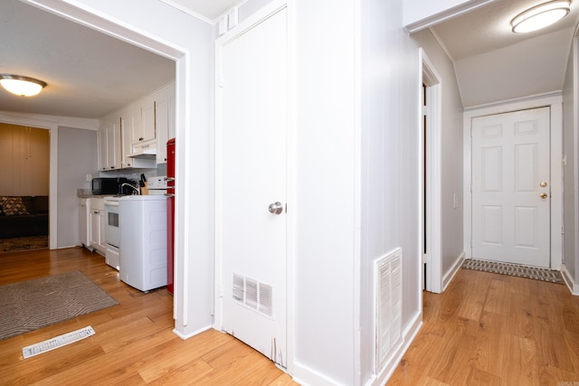 hall with light wood-type flooring