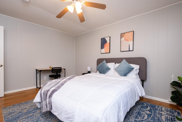 bedroom featuring ceiling fan and hardwood / wood-style floors