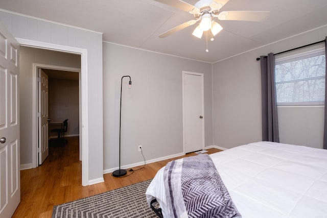 bedroom featuring ceiling fan and hardwood / wood-style floors