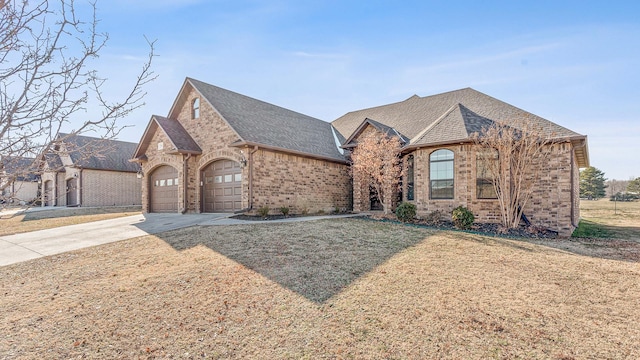 view of front of house with a front lawn and a garage