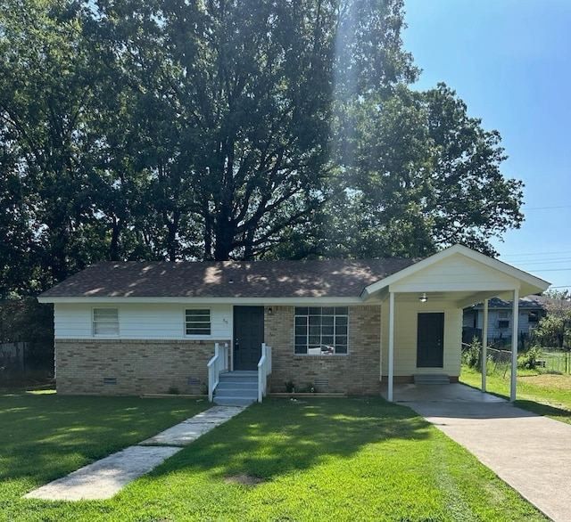 ranch-style home with a front yard and a carport