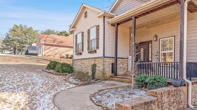 view of side of property with a porch