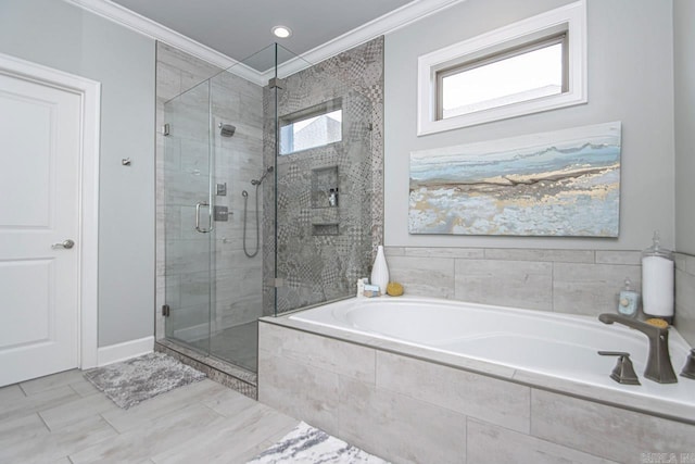 bathroom featuring separate shower and tub and ornamental molding