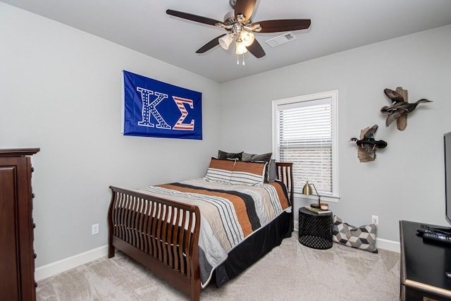 bedroom with light colored carpet and ceiling fan