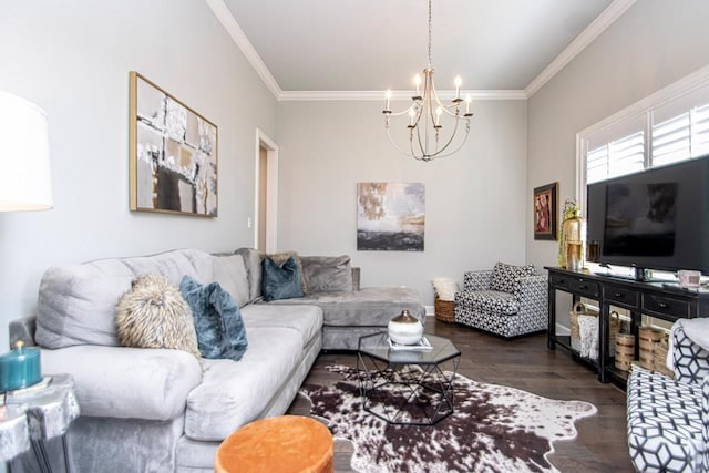 living room featuring ornamental molding, a chandelier, and dark hardwood / wood-style flooring