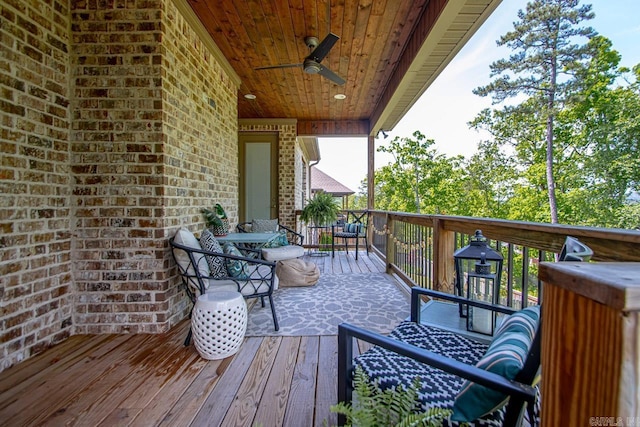 wooden deck featuring ceiling fan