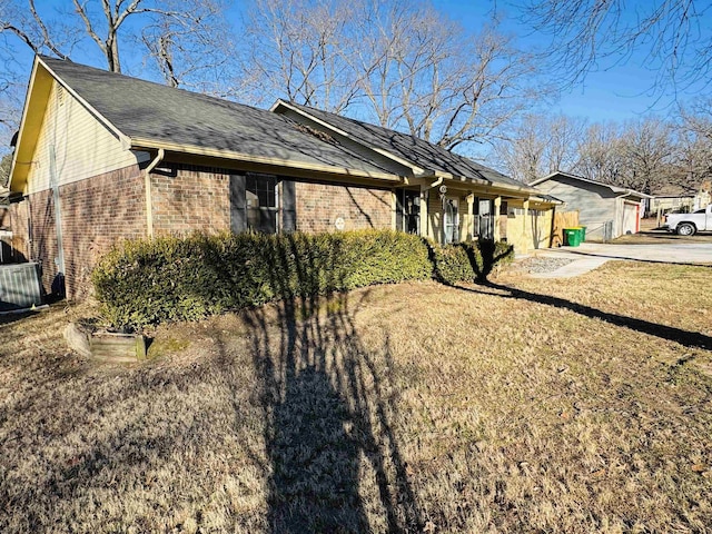 view of property exterior with a lawn