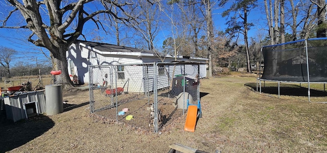 view of yard with a trampoline