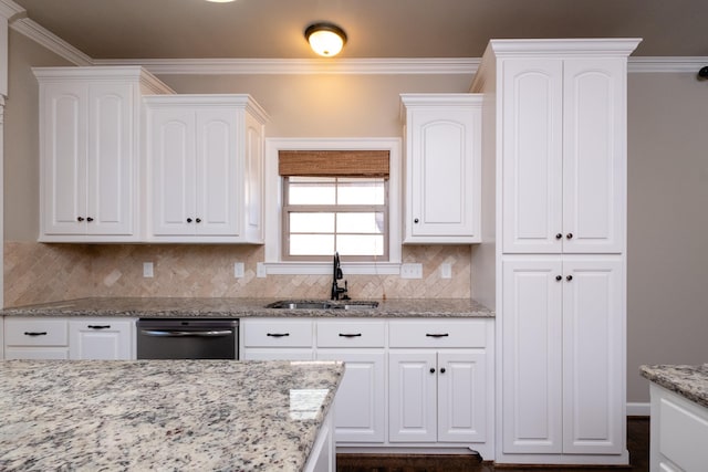 kitchen with sink, backsplash, white cabinetry, light stone counters, and ornamental molding