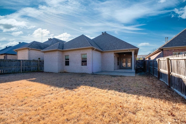 back of property with a patio area