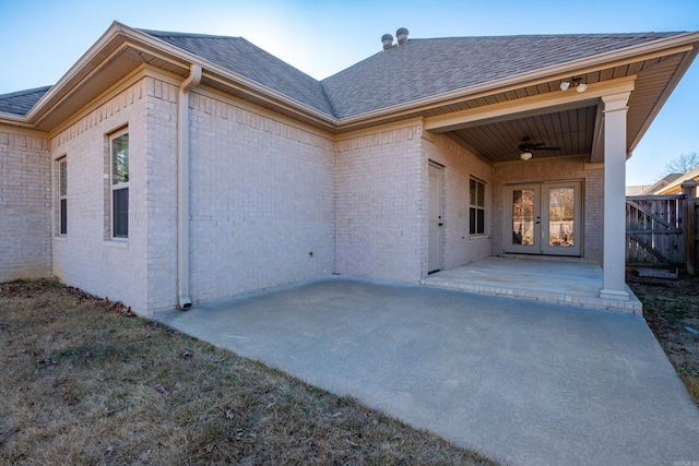 rear view of property featuring a patio, ceiling fan, and french doors