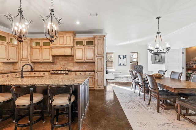 kitchen with crown molding, backsplash, light brown cabinetry, and light stone counters