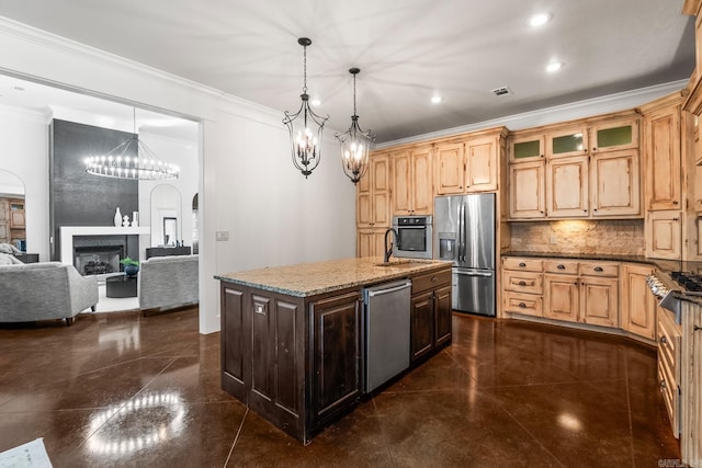 kitchen featuring pendant lighting, backsplash, light stone countertops, a kitchen island with sink, and stainless steel appliances