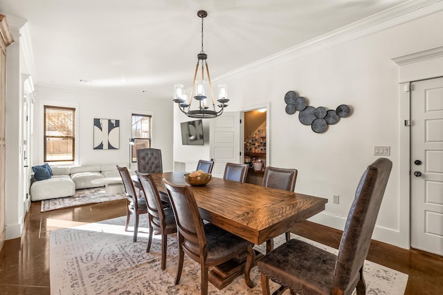 dining area with a notable chandelier and crown molding