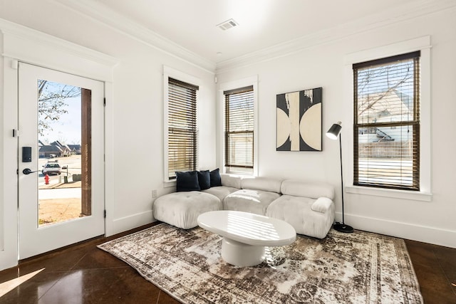 living room featuring a wealth of natural light and ornamental molding