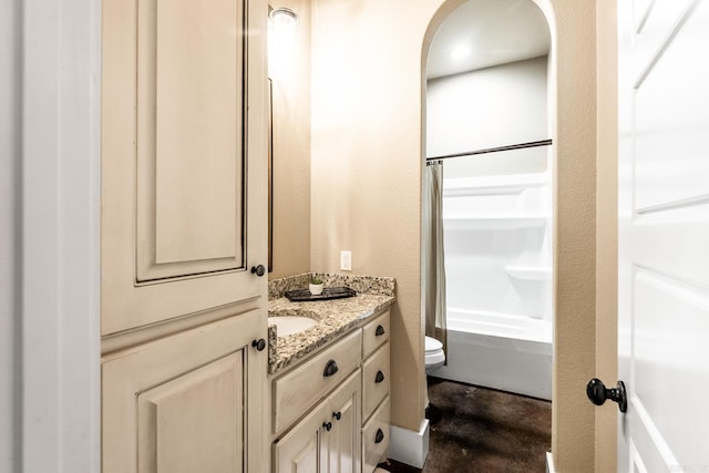 full bathroom featuring vanity, toilet, and shower / tub combo with curtain