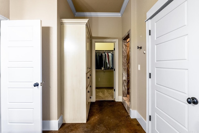 corridor with dark carpet and ornamental molding