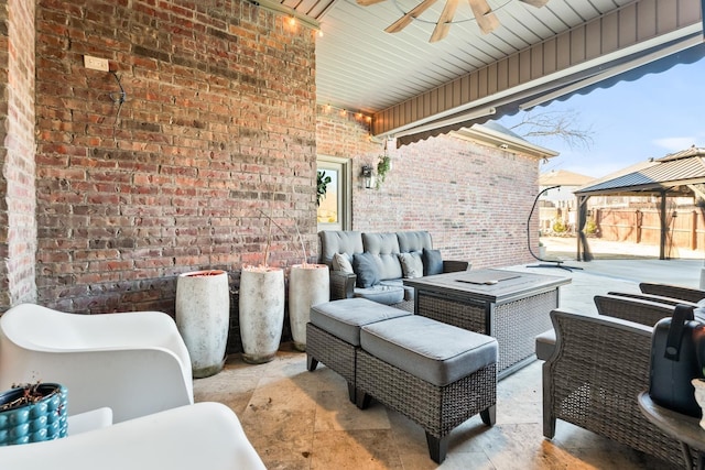 view of patio / terrace featuring an outdoor living space, a gazebo, and ceiling fan