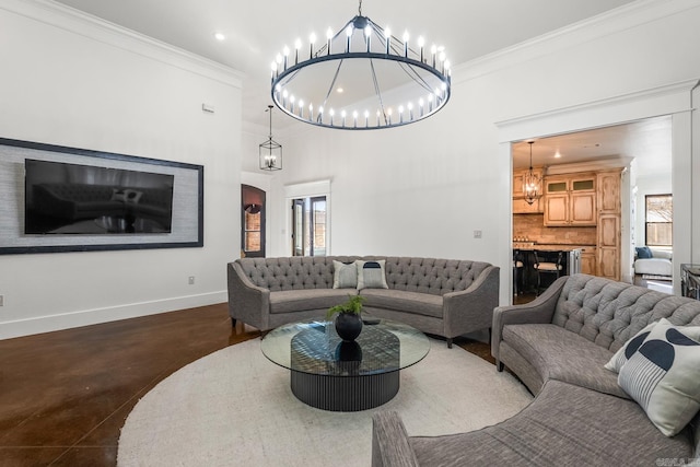 living room featuring crown molding and a chandelier