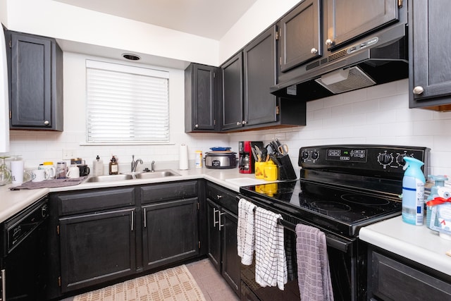 kitchen featuring sink, black appliances, decorative backsplash, and light tile patterned floors