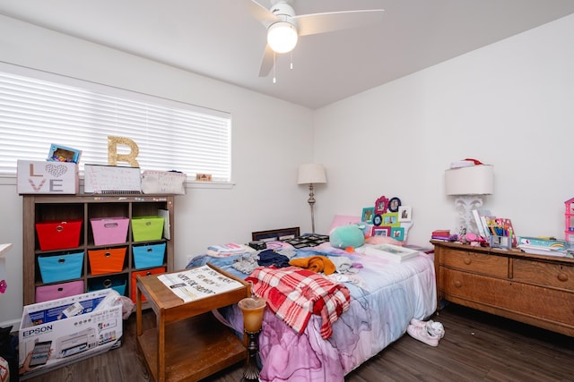 bedroom featuring dark hardwood / wood-style floors and ceiling fan