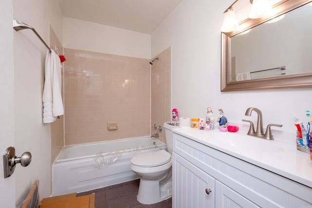 full bathroom with tile patterned floors, tiled shower / bath combo, vanity, and toilet