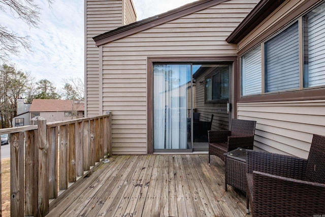 wooden terrace featuring an outdoor hangout area