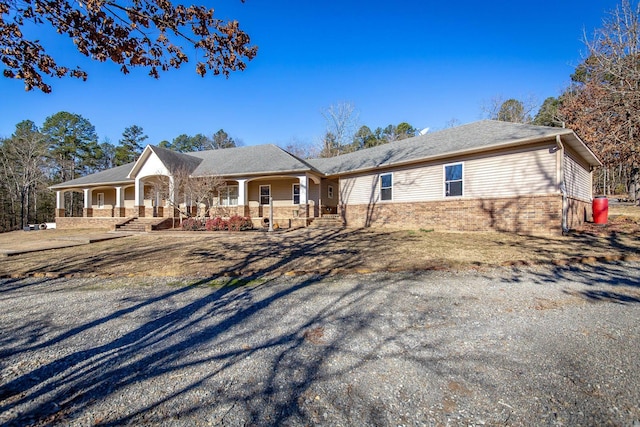 ranch-style house featuring a porch