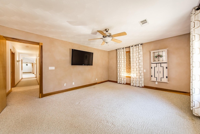 unfurnished bedroom with ceiling fan and light carpet