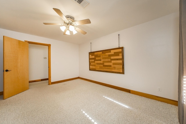 empty room featuring light carpet and ceiling fan