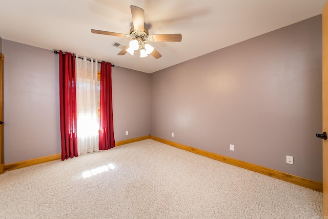 spare room with ceiling fan and carpet flooring