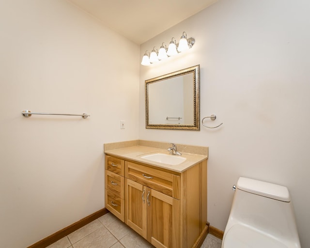 bathroom with vanity, toilet, and tile patterned floors