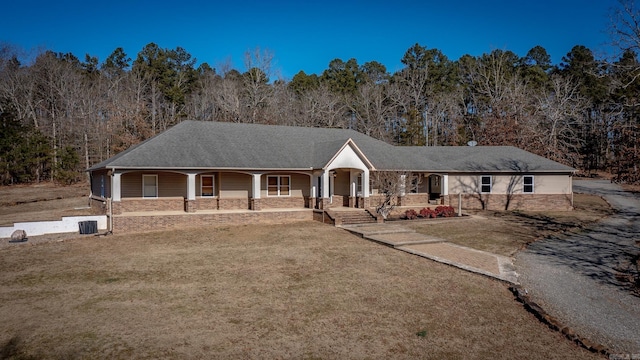 view of front of house with a front yard and a porch