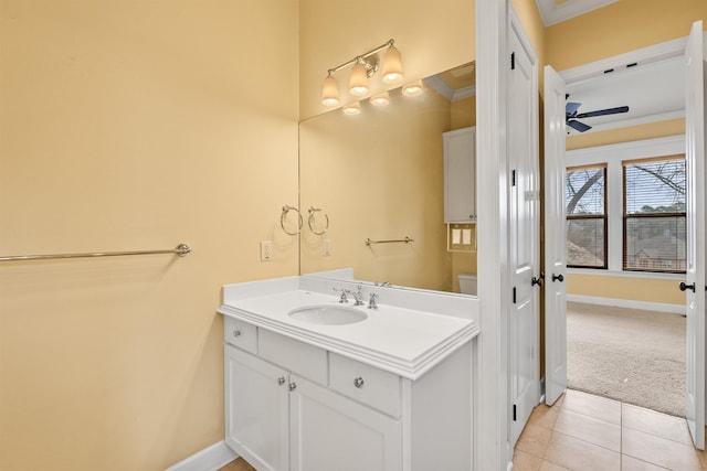 bathroom with vanity, tile patterned floors, ceiling fan, and ornamental molding