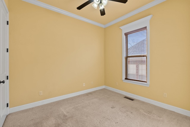 unfurnished room with ceiling fan, ornamental molding, and light carpet