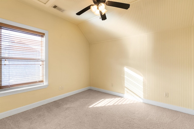 additional living space with carpet floors, lofted ceiling, and ceiling fan