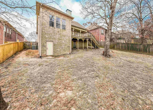 back of property featuring a wooden deck and central AC