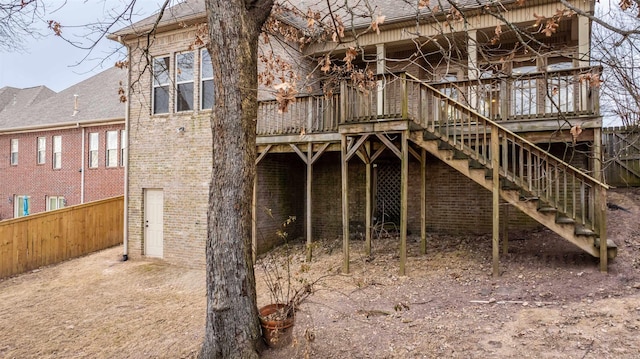 back of house featuring a deck