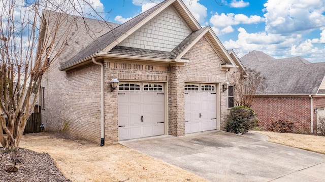 view of side of home featuring a garage