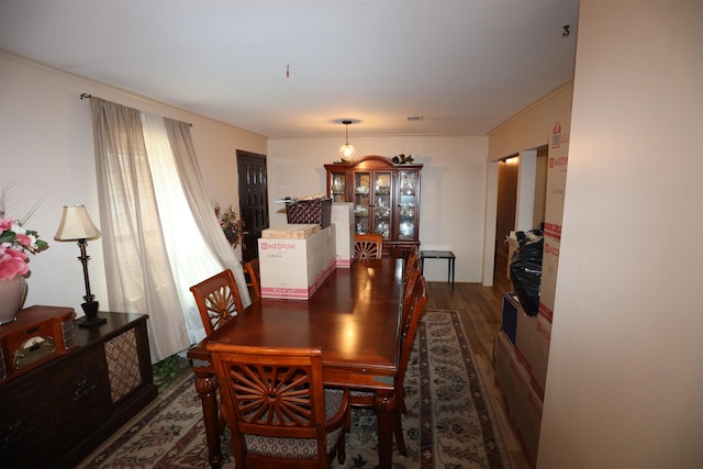 dining space with dark hardwood / wood-style floors