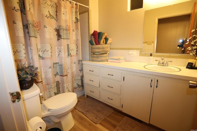 bathroom featuring vanity, toilet, walk in shower, and wood-type flooring