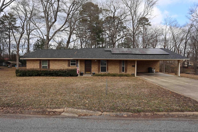 single story home featuring a front yard and a carport