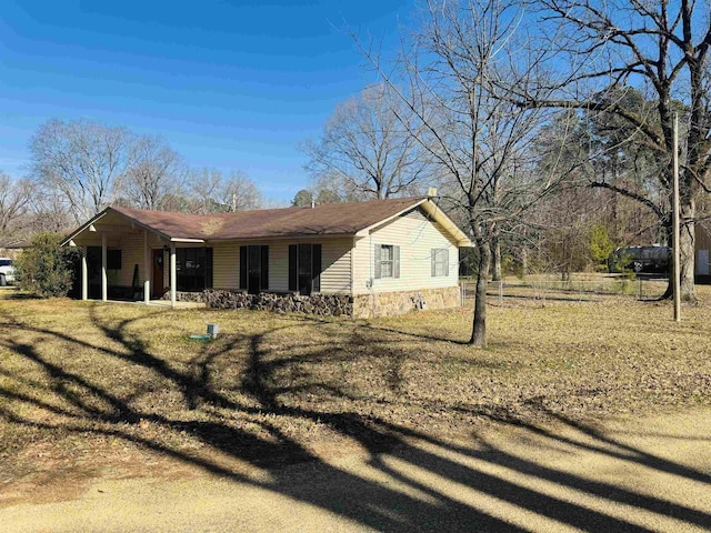 view of side of property with a yard