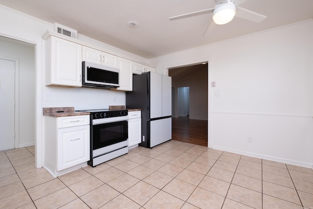 kitchen featuring ceiling fan, white cabinetry, white appliances, and light tile patterned floors