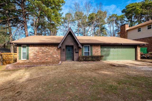 ranch-style house with a garage and a front lawn