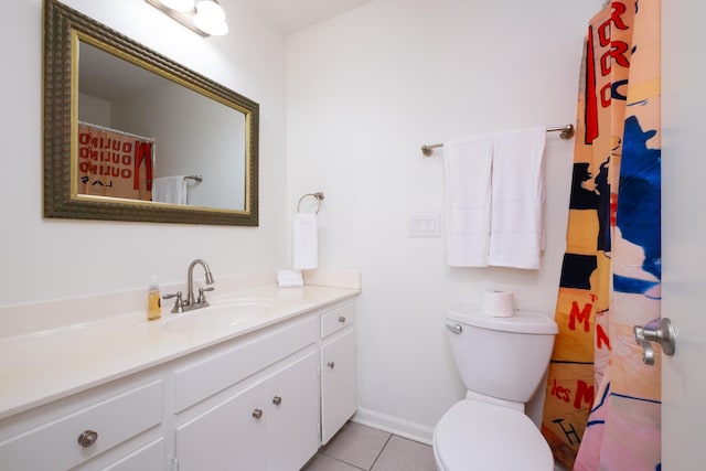 bathroom featuring toilet, tile patterned flooring, and vanity