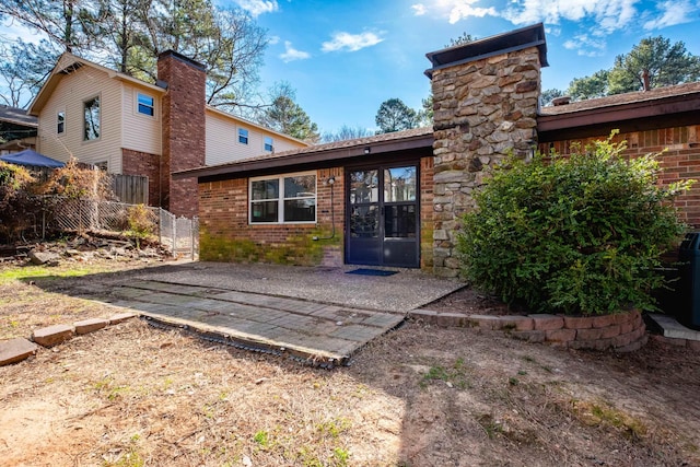 back of house featuring a patio area and french doors