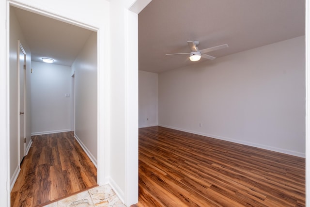 hall with wood-type flooring