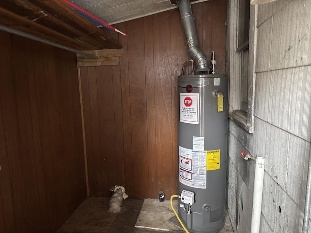 utility room featuring gas water heater